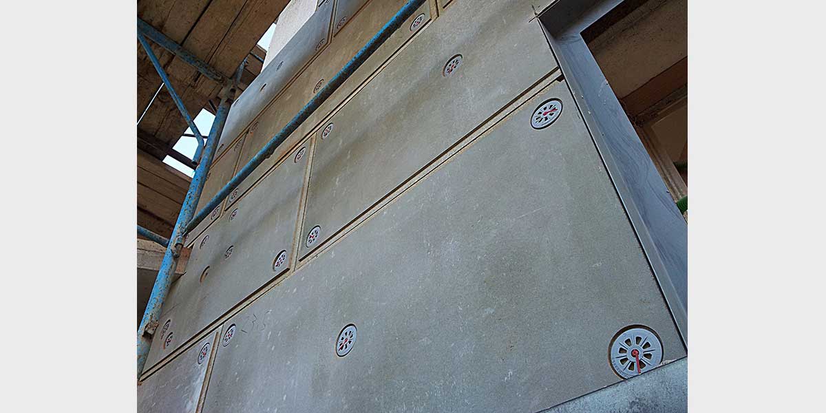 Reinforced insulating wall system